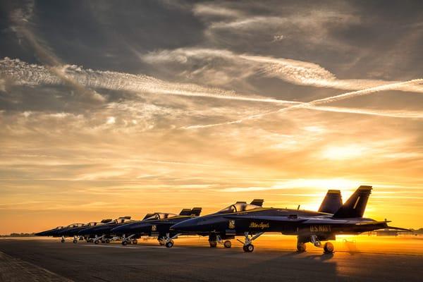 Sun setting behind parked blujays