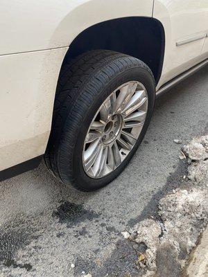 Wheel is close to falling off from the car.