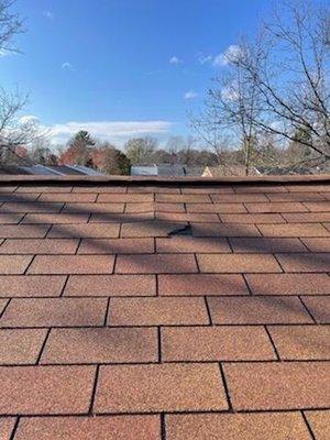 My townhouse roof is warped in less than two years. Crack shingles