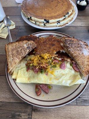 2 Blueberry pancakes and the Kielbasa Omelette with hash browns.