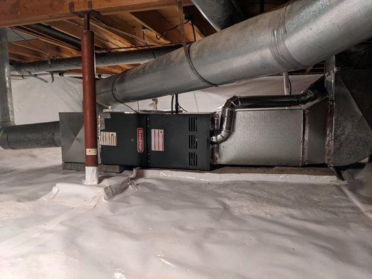 The evaporator coil was attached to the right side of the furnace and a filter box was installed on the left.