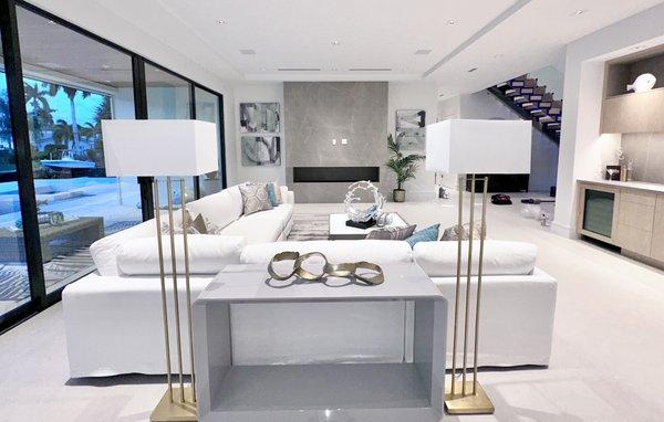 Lamps behind a sofa with console table