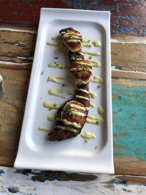 Scallops over a slab of bacon.