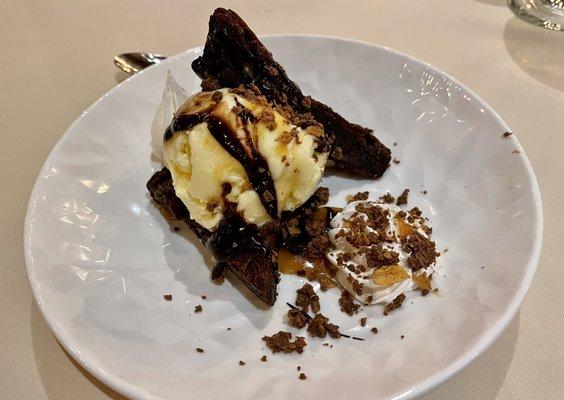 Double chocolate brownie with vanilla bean ice cream and hazelnut sprinkles