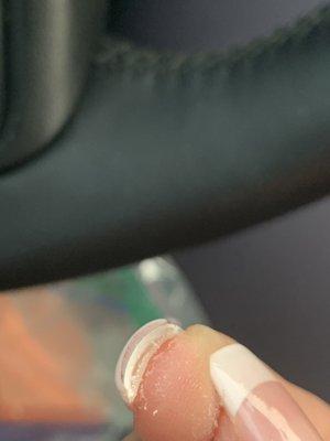 Real nail has a gap between fake nail