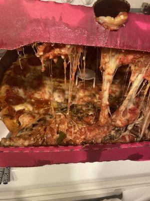 How I received my pizza (door dash) assume it didn't leave Rizzo's in this condition but I paid $36 for this ridiculous mess.