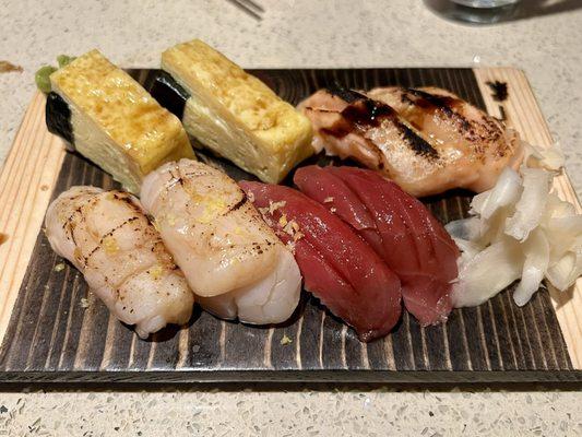 Top left clockwise: Tamago, Salmon Belly Aburi, Bluefin Tuna, Hotate (Hokkaido Scallop) Aburi