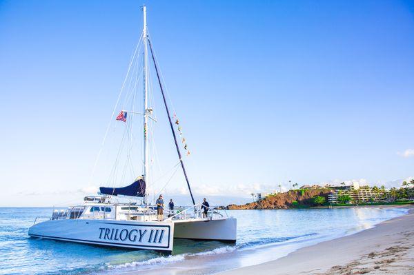 Maui's newest sailing catamaran, TRILOGY III beach loading in Ka'anapali.