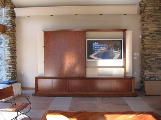 This large flat panel TV was installed on the wall inside a custom built cabinet. All equipment was installed inside the cabi...