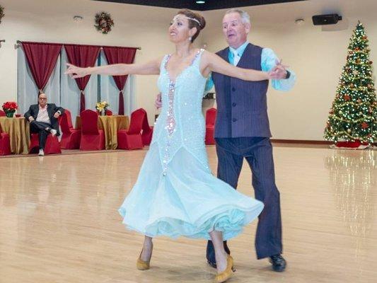 Jeanette dancing with student at Holiday Dance Showcase