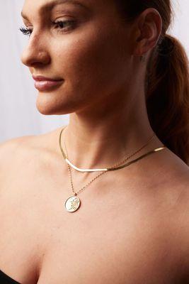 Golden Layers. Pictured 14k Elemental Coin necklace by Viviana Langhoff and heirlingbone chain.