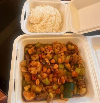 Three meat Kung Pao chicken, beef and shrimp.