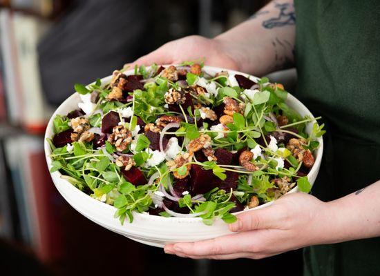 arugula & beet salad with walnuts, shaved onion, & goat cheese