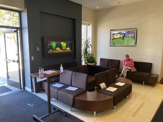 A spacious well appointed waiting lobby complete with fish tank for zen and sports on TV for excitement.