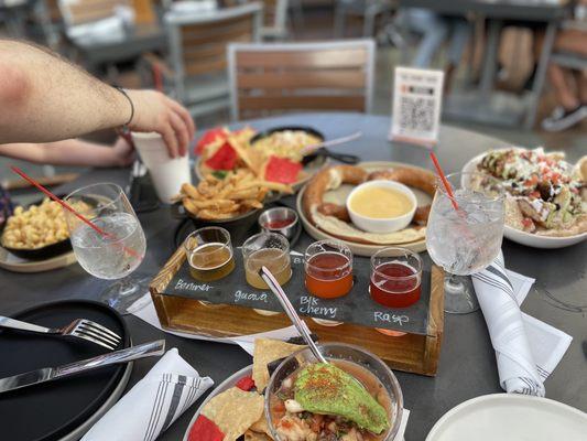 Berry white flight  Pretzel and cheese Mac and cheese with a side of fries  Chicharon nachos  Corn plate