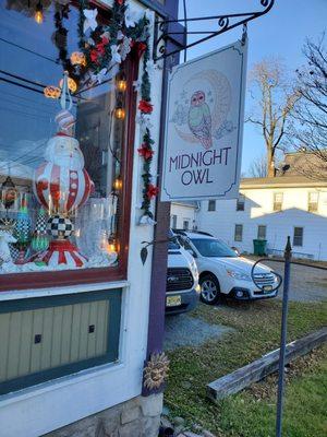 Midnight Owl's sign, and a little bit of the window display