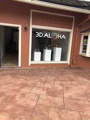 Front door and window facing Makawao Avenue