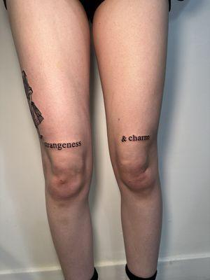 Above knee script tattoo