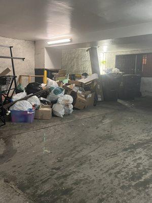 Trash area overflowing with no explanation