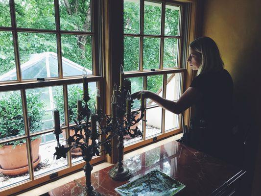 Cleaning divided-light windows inside a home