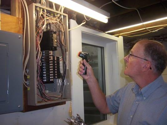 Inspecting the electrical panel.