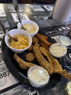 Fried catfish, hush puppies, corn fritters, Mac and cheese, mashed potatoes, tartar sauce