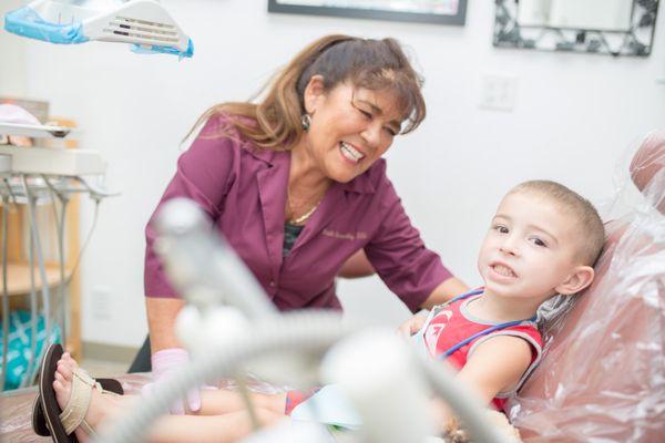 Dr. Ruth Kenworthy working with a young patient.