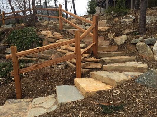 Grand stone staircase and accompanying low maintenance landscape!