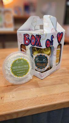 Box of Love and tub of cheese bread spread