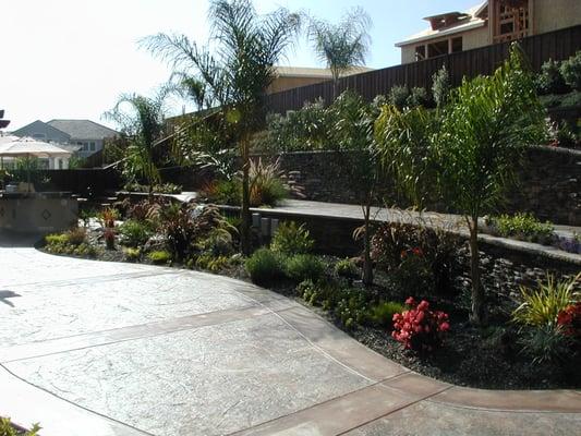 Dublin Ranch Home: Raised patios, stamped colored concrete and tropical landscape