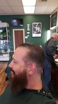 Sharp taper into a curtain cut and beard trim and shape up