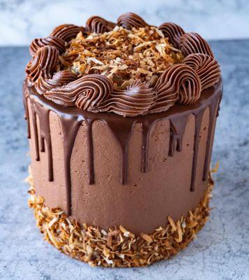 German chocolate cake with chocolate ganache icing and coconut pecan filling. We specialize in dessert cakes.