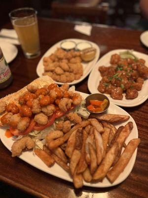 Front: Popcorn Shrimp Po Boy, back left: Popcorn Shrimp, back right: Buffalo Cauliflower (Thai chili sauce)