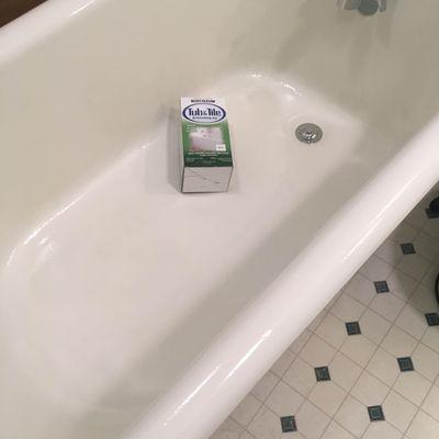 Refinished old cast iron clawfoot tub with epoxy paint, and replaced all of the faucet and drain hardware with new.