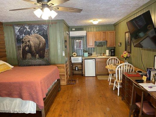 The Mountain Lodge Room with 1 Queen bed, 2 leather rocker Recliners, Kitchenette, & private bathroom with tub/shower.