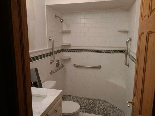 Bathroom gut remodel/conversion. Removed tub and made into walk In shower with seat.