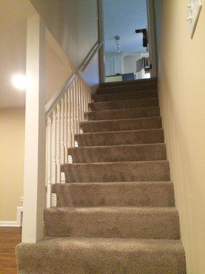 "After" photo of stairwell from basement remodel