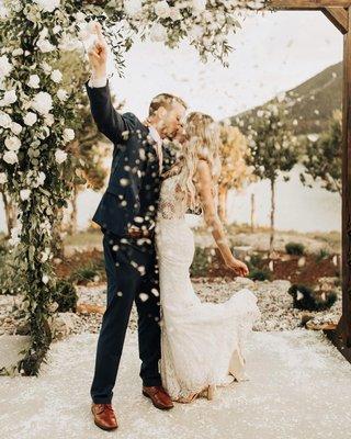 Bride and Groom on the waterfront patio at Vista View Events following their ceremony.