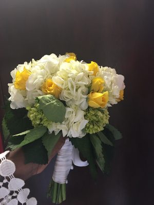 Full bouquet of hydrangeas with a splash of yellow. Maybe not traditional but sure was gorgeous!