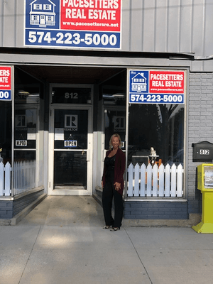 Corinna Summers standing outside the Rochester IN Satellite office.  We lease office space from Pacesetters Real Estate...