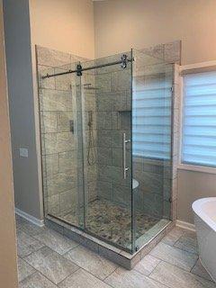 Shower Enclosure with custom shower pan to accommodate clients requirements.