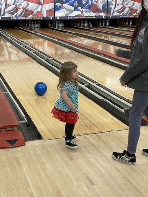 Kids bowling on bumpers