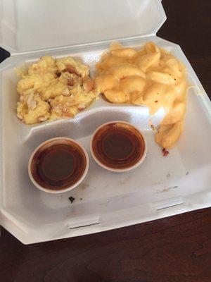 Macaroni and cheese and banana pudding. Meat sampler comes with two cups of delicious BBQ sauce. Not needed!