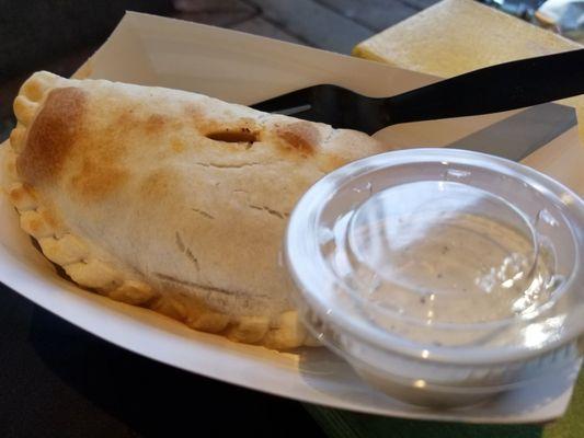 Empanada, chicken, green and red peppers, onions green chili sauce