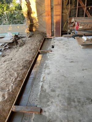 Concrete pour for sliding doors installation