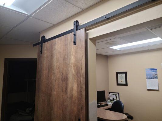 Removed metal frame did drywall work and hung a barn door in dentist office