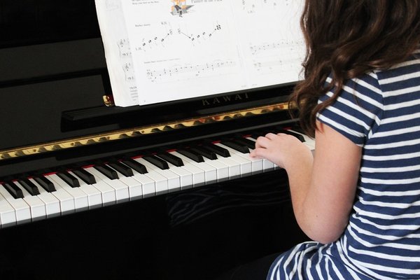 Student with Piano