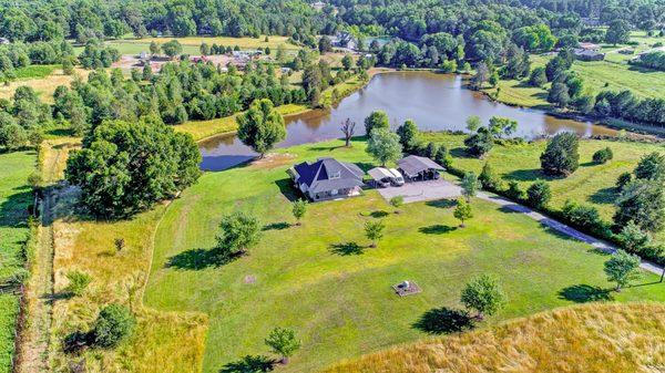 A Picture Perfect Mini Farm! Spectacular private estate on 8 +/- acres & stocked Pond! Call today for an appointment to see this property.