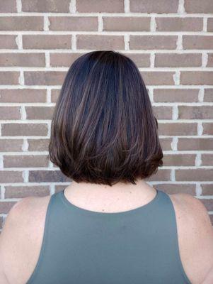 This was a HUGE change!  Her hair was past bra strap length before her appointment.  She wanted a big change with lots of body.