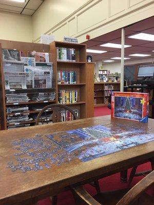 Community Puzzle. Newspapers like Wall Street Journal, New York Times, USA Today, Watertown Daily News.  Large Print Books.